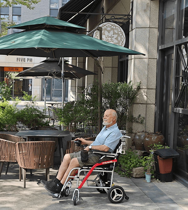 White folding electric wheelchair.