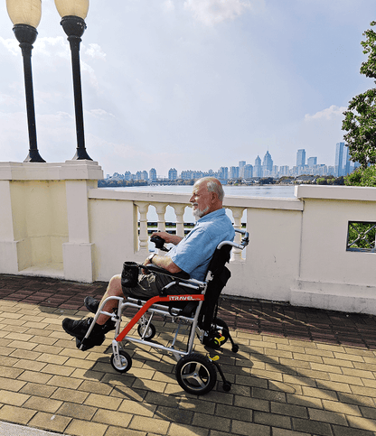 White folding electric wheelchair.