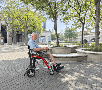 White folding electric wheelchair.