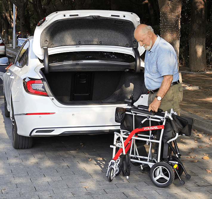 White folding electric wheelchair.