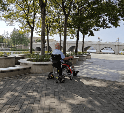 White folding electric wheelchair.