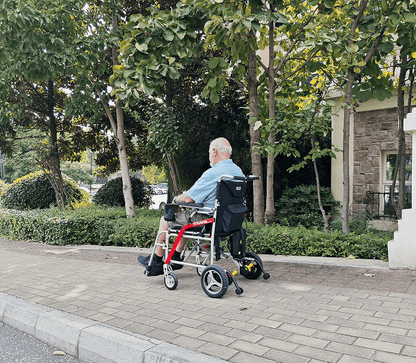 White folding electric wheelchair.